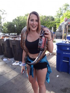 A Utah Pride Festival 2016 Attendee dawned with a large snake holding Ruby's Gay